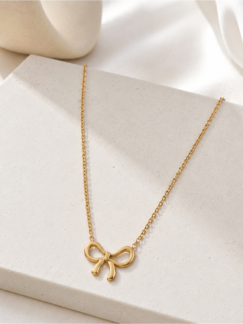 Gold Tone Bow Pendant Necklace